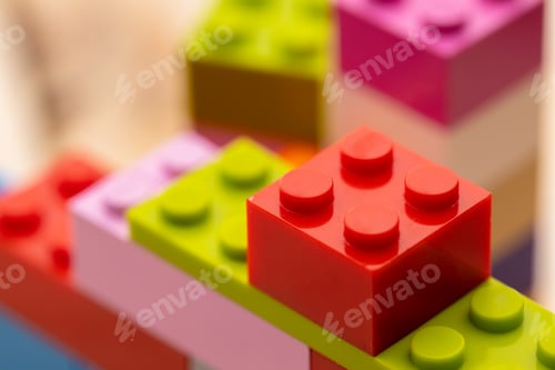 Preview: Toy building kit details on wooden background