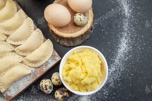 Preview: top view raw little hotcakes with flour mushed potatoes and eggs on dark background pie dough bake