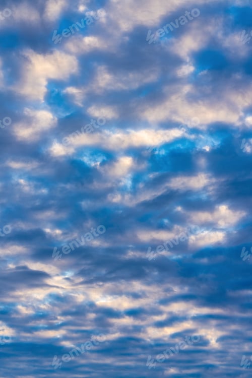 Preview: Clouds in blue sky, illuminated by rays of sun at sunset to change weather. Cloudscape background