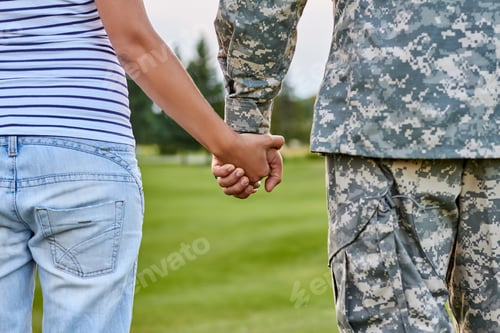 Preview: Hands holding, back view.