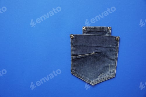 Preview: Stylish jeans pockets on blue background, top view. Space for text