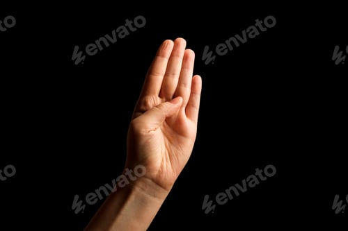 Preview: Hand Showing Sign of B Alphabet in American Sign Language (ASL), isolated on black background.