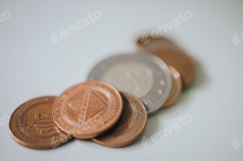 Preview: Selective focus shot of the convertible mark coins on a white table