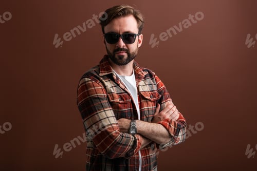 Preview: Stylish man in plaid shirt and sunglasses