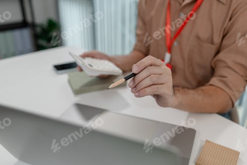 Preview: an accountant is working on company's number in the office
