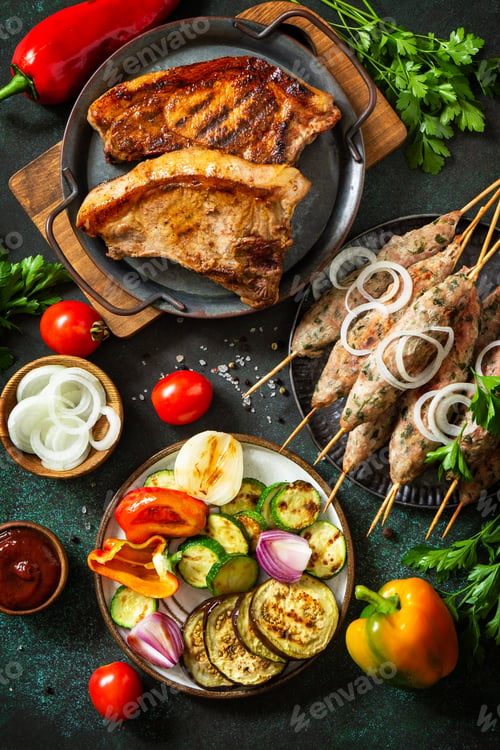 Preview: Homemade Kofta kebabs, grilled steak and grilled vegetables on a skewer with vegetables