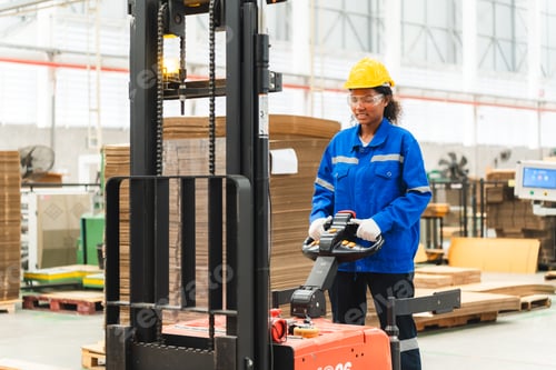 Preview: paper cardboard manufacture factory concept, industry worker person working with recycling machine