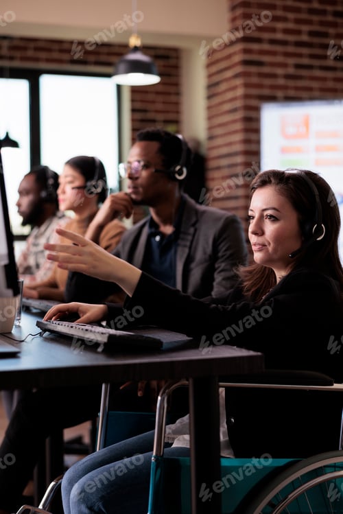 Preview: Woman living with disability answering client call at customer service