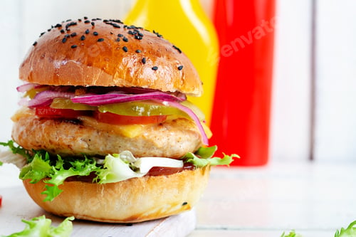 Preview: Sandwich with chicken burger, tomatoes, cheese, pickled cucumber and lettuce. Cheeseburger.