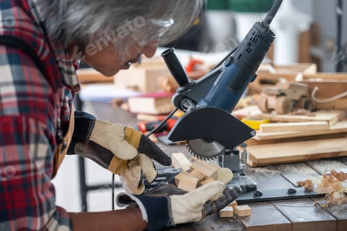 Preview: Carpenter working on woodworking machines in carpentry shop, wooden product