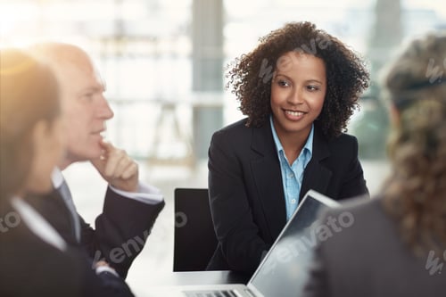 Preview: Hes got their attention. Cropped shot of a group of businesspeople in a meeting.