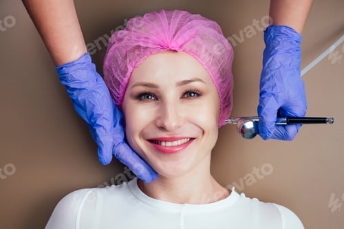 Preview: woman getting facial massage with oxy air spray .oxygen therapy in spa salon