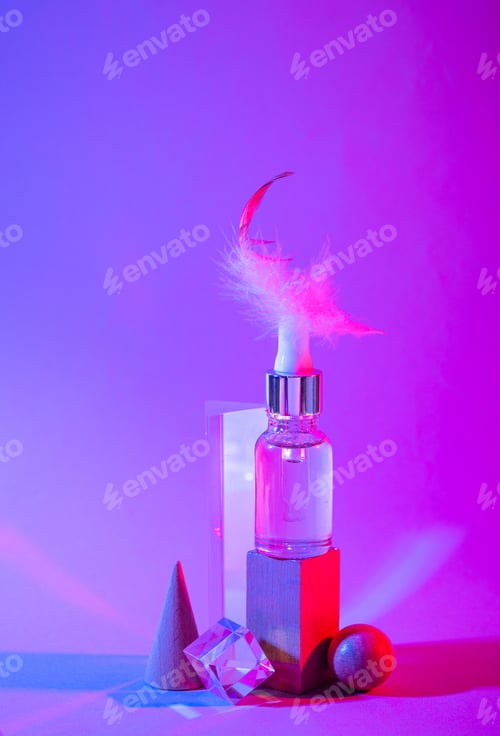 Preview: Bottle of cosmetic serum in neon light