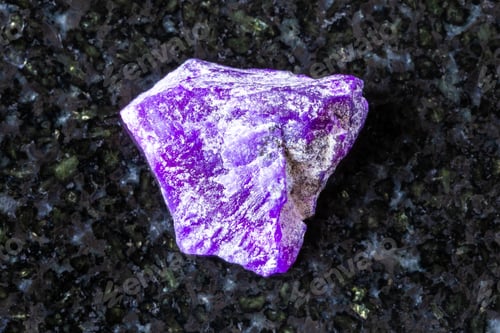 Preview: sample of raw sugilite mineral on black granite