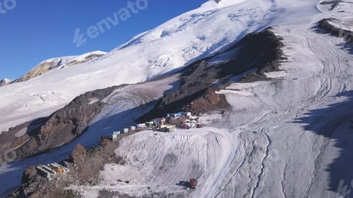 Preview: Snow capped mountain peaks in winter with the shelter for hikers. Clip. Aerial view of the snowy