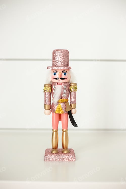 Preview: Pink and gold and silver sparkly Christmas nutcracker on white background