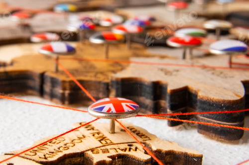 Preview: United Kindom flag on the pin with red thread showed the paths on the wooden map.