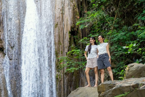 Preview: Asian Indonesian Women Exploring Grojogan Sewu Waterfall in Yogyakarta Forest