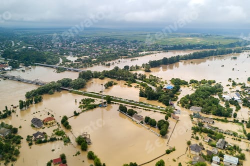Preview: Aerial view of flooded houses with dirty water of Dnister river in Halych town, western Ukraine.