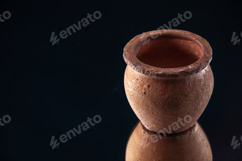 Preview: front view brown little pot on black background ceramics color darkness plate food meal