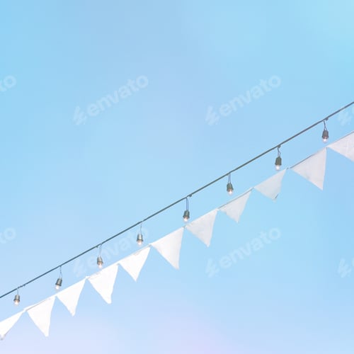 Preview: White bunting flag against blue sky
