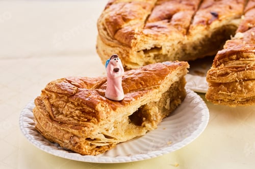 Preview: Epiphany cake on wooden table. Galette des rois traditional Epiphany cake in France