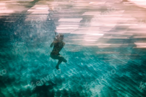Preview: Woman diving underwater for snorkeling