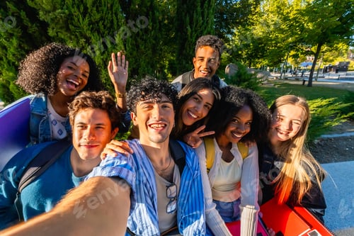 Preview: Diverse university students taking a joyful campus selfie