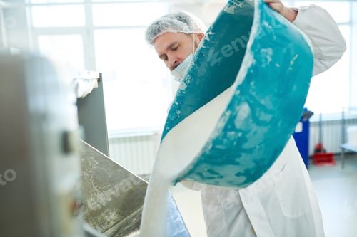 Preview: Confectioner poured out sugar in vat