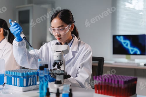 Preview: Scientist using micropipette and analyzing samples in laboratory