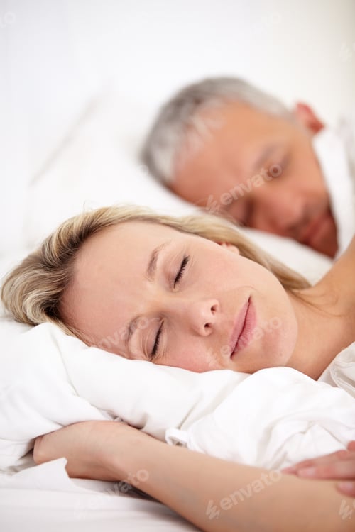 Preview: Comfort in companionship. Closeup portrait of a mature couple sleeping peacefully.
