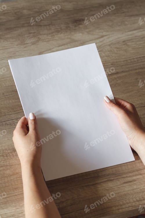 Preview: female hands with a sheet of paper