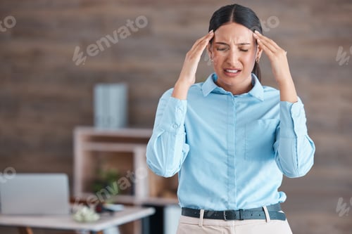 Preview: Beautiful mixed race business suffering with a headache while standing in her office. Young corpora