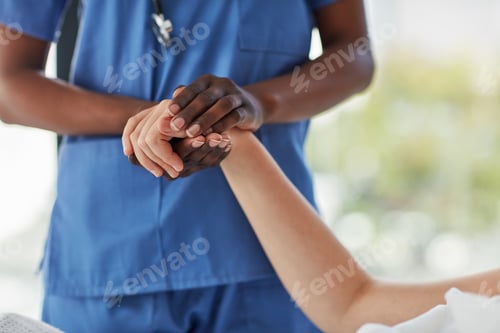 Preview: Closeup shot of a medical practitioner holding a patients hand in comfort