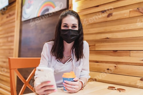 Preview: Woman in a cafe in quarantine.