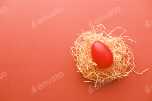 Preview: easter concept with red color egg on a red background