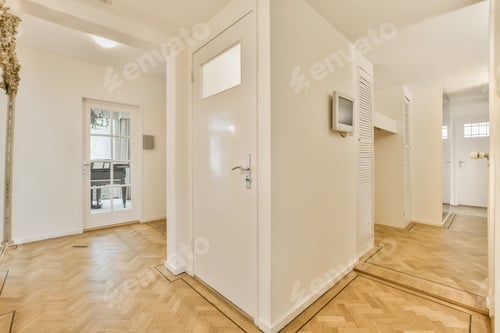 Preview: a living room with a white door and a door