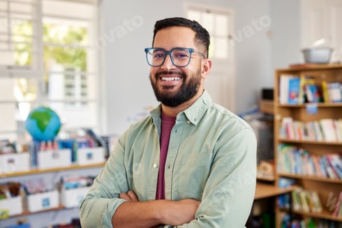 Preview: Happy multiethnic male teacher smiling at primary school