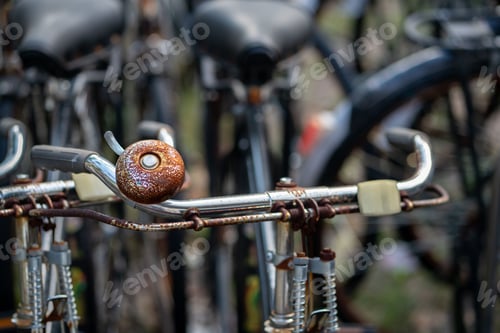 Preview: Closeup of a rusty bicycle bell standing outdoor