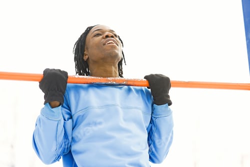 Preview: African american man doing exercise on winter day
