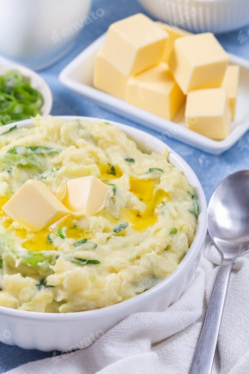 Preview: Traditional Irish dish Colcannon or mashed potato with green cabbage and butter, vertical