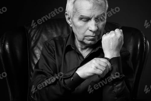 Preview: Monochrome portrait of elderly thoughtful man in studio