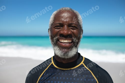 Preview: Old man smiling at the beach