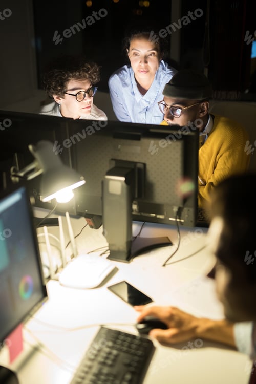 Preview: Group of Colleagues Working at Night
