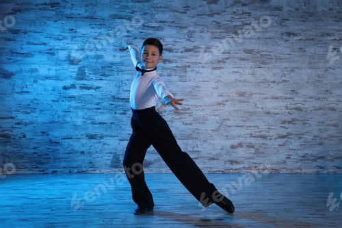 Preview: Beautifully dressed little boy dancing in studio
