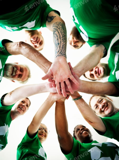Preview: People joining hands together and smiling