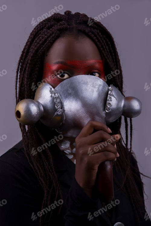 Preview: Potrait of a black woman putting on a mask