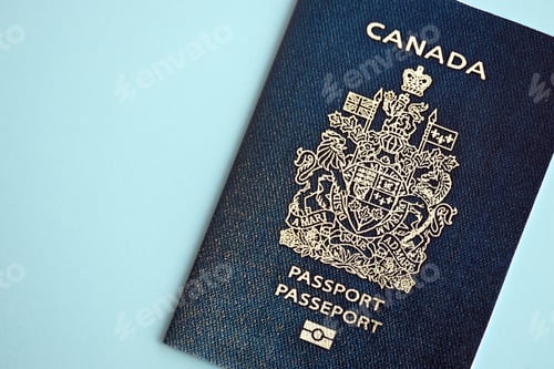 Preview: Canadian passport on blue background close up