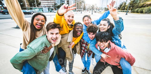 Preview: Group of young people with hands up looking at camera