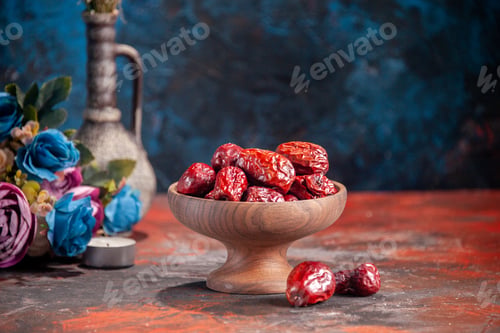 Preview: front view dried red jujubes on blue background fruit dry holiday horizontal sour